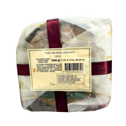 Ansicht von unten des Panettone Schokolade Loison 1 kg, die die Details der Verpackung und das handwerkliche Etikett des Hauses Loison hervorhebt.