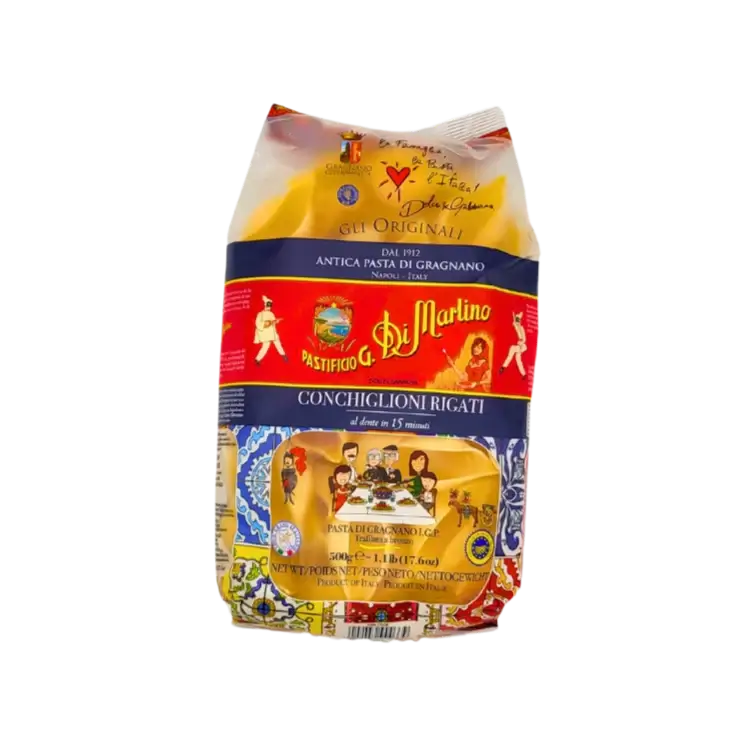 Paquet de Conchiglioni Rigati 500g de Pastificio Di Martino, avec illustration Dolce & Gabbana et aperçu des pâtes à travers la fenêtre transparente