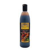 Face avant de la bouteille de crème au vinaigre balsamique de Modène I.G.P. Acetaia del Casale 500ml, étiquette noire et dorée illustrée de fruits, légumes et mets gourmands.