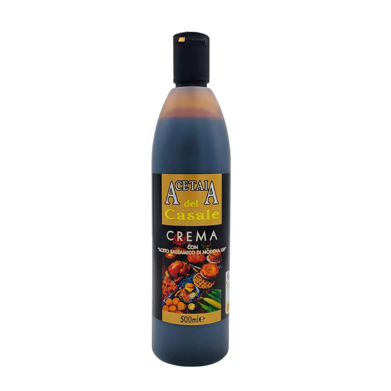 Face avant de la bouteille de crème au vinaigre balsamique de Modène I.G.P. Acetaia del Casale 500ml, étiquette noire et dorée illustrée de fruits, légumes et mets gourmands.