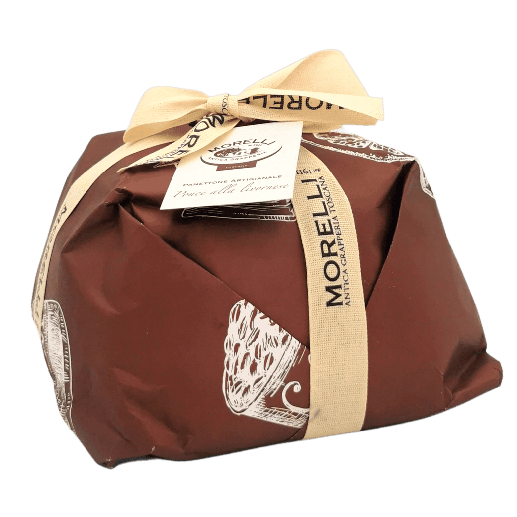 Panettone mit Zartbitter-Schokolade Punch Livournais 750 g, verpackt in braunem Papier mit Schleife und sichtbarem Etikett « Tradition Toscane ».